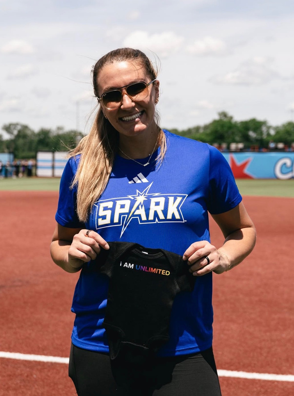 Softball athlete wearing a Spark shirt on the field